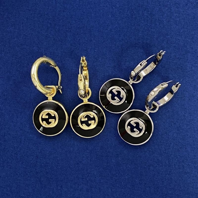 G*u*i earrings